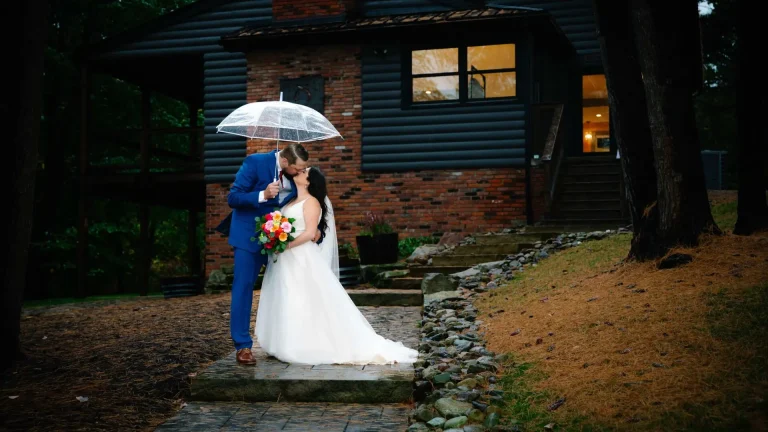 Romantic Rainy Wedding Moment Outside Rustic Cabin
